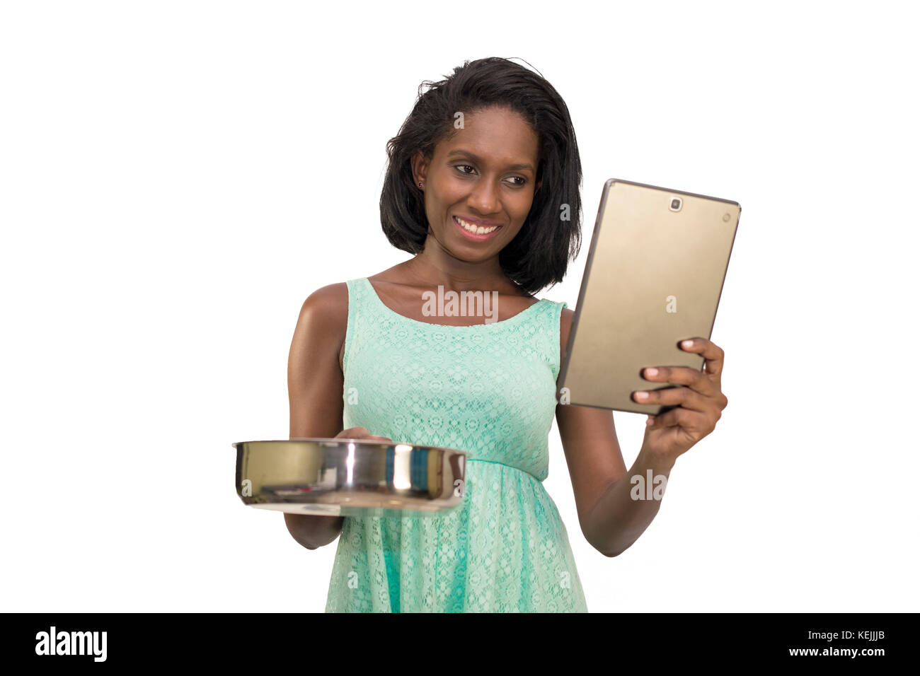 Lächelnde Frau mit Pan und Tablet Stockfoto