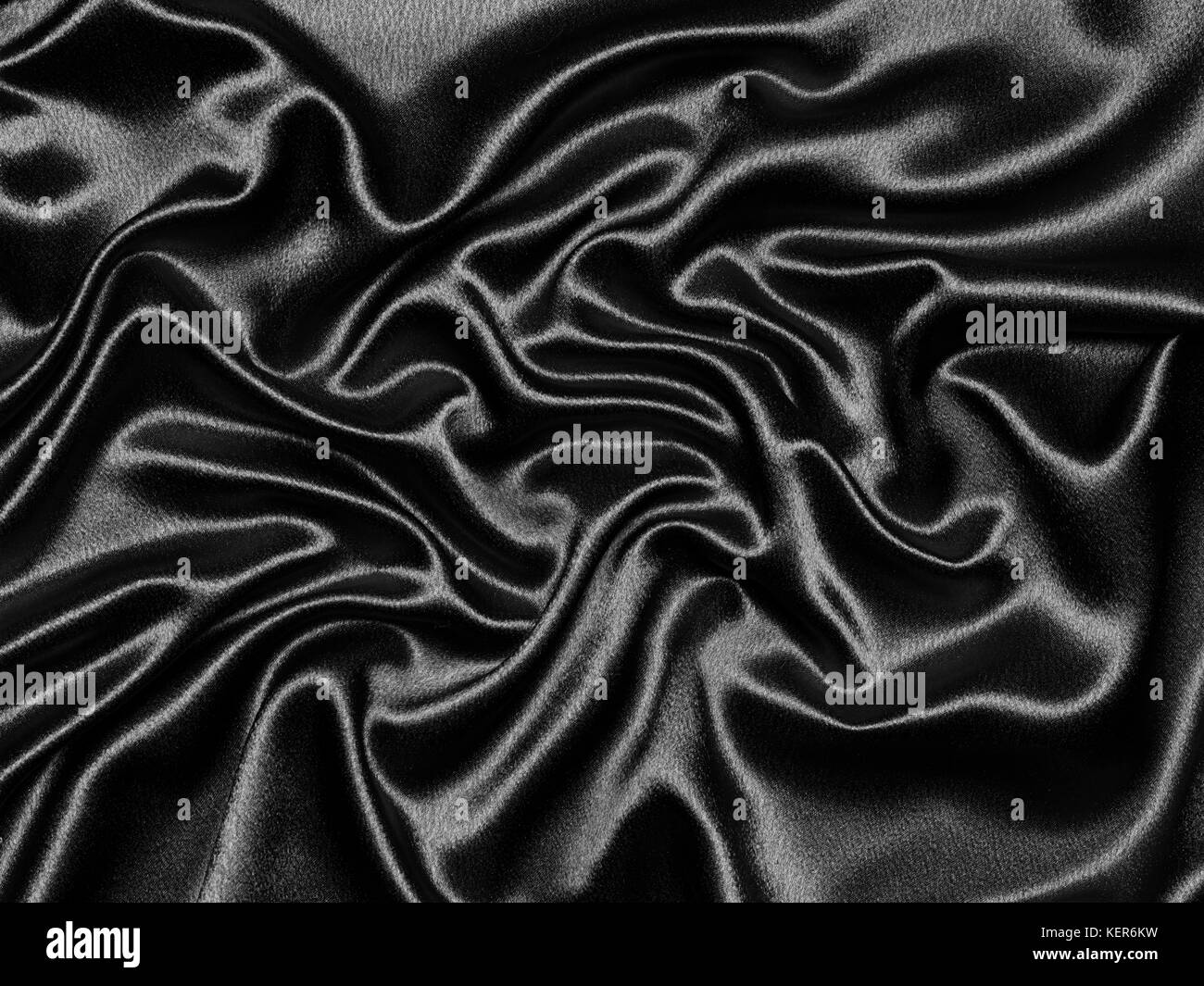 Luxuriöse, elegante Wellen aus Seide oder Satin in Schwarz für abstrakten Hintergrund Stockfoto