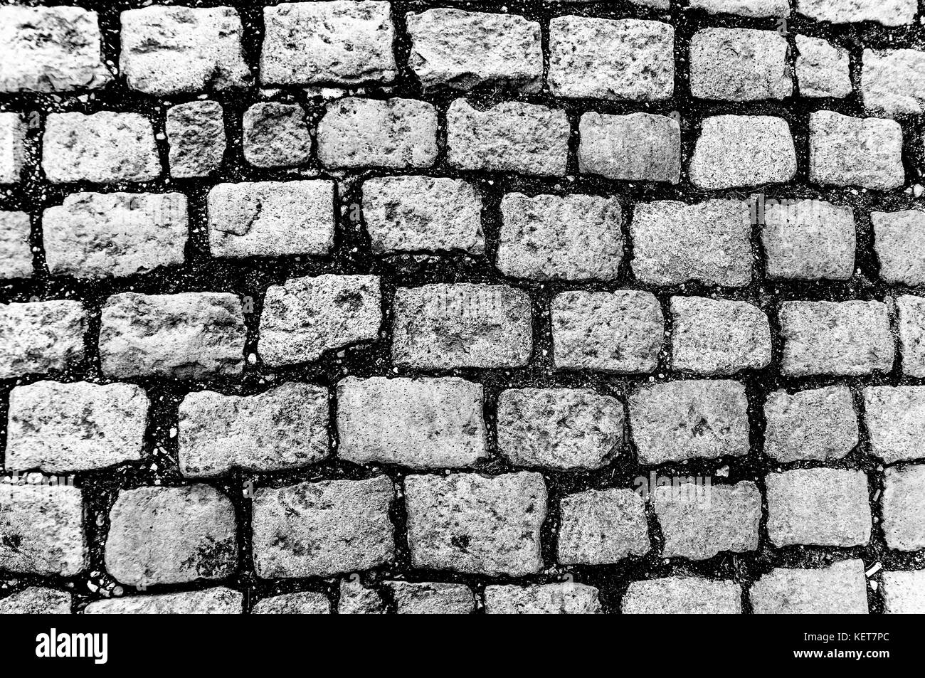Abstrakte B&W Hintergrund der alten Kopfsteinpflaster Stockfoto