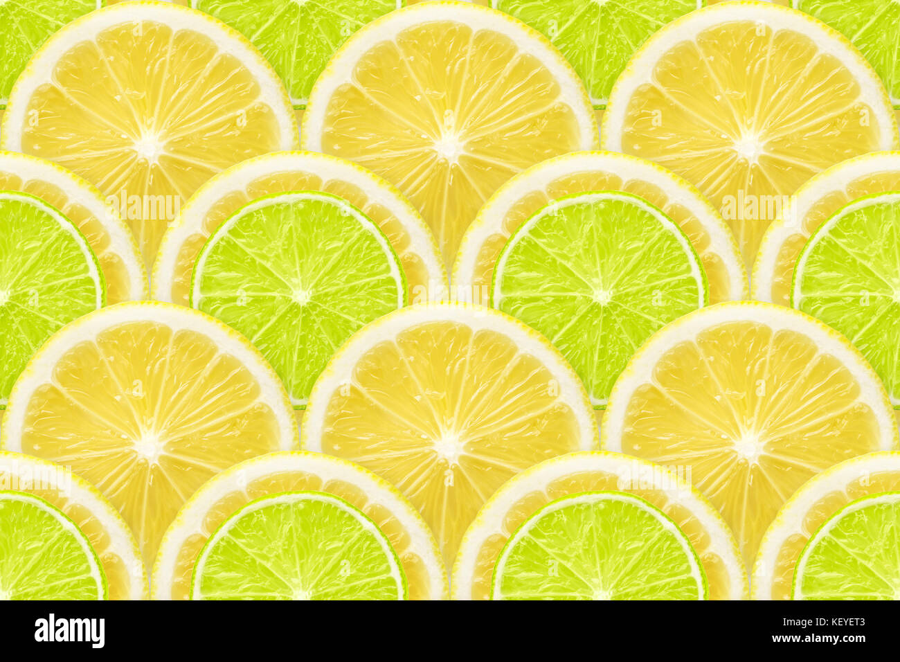 Frische regelmäßige natürliche Muster aus vielen Zitrone und Limette Schnitte Stockfoto