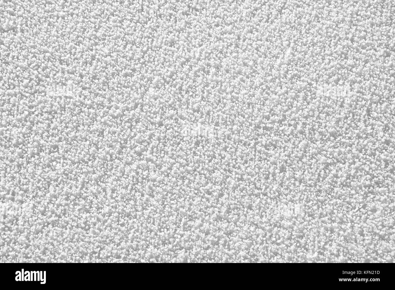 Der Bereich der Schnee Eiskristalle an einem sonnigen kalten Wintertag. Textur. Stockfoto