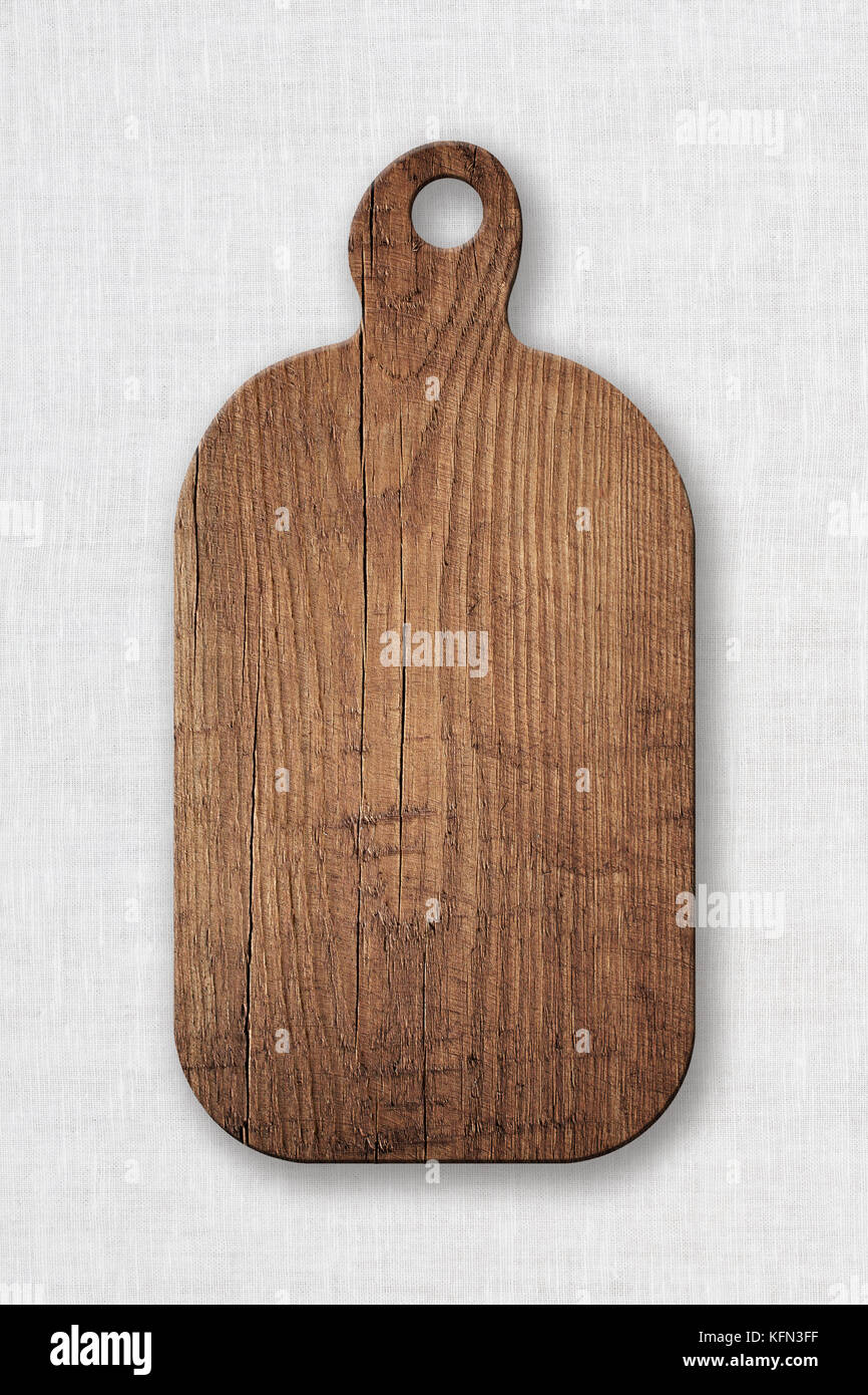 Braun zerkratzte Holz schneiden, choping Board auf weißen Tischdecke. Stockfoto
