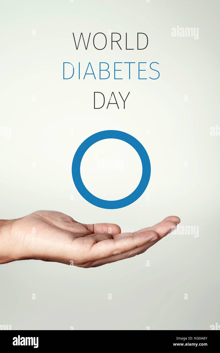 Text Welt diabetes Tag und ein blauer Kreis, das Symbol des Diabetes, in der Hand eines jungen Mannes Stockfoto