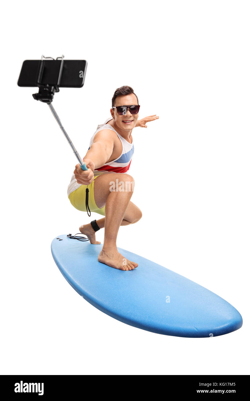 Junger Mann surfen und eine selfie mit einem Stock auf weißem Hintergrund Stockfoto