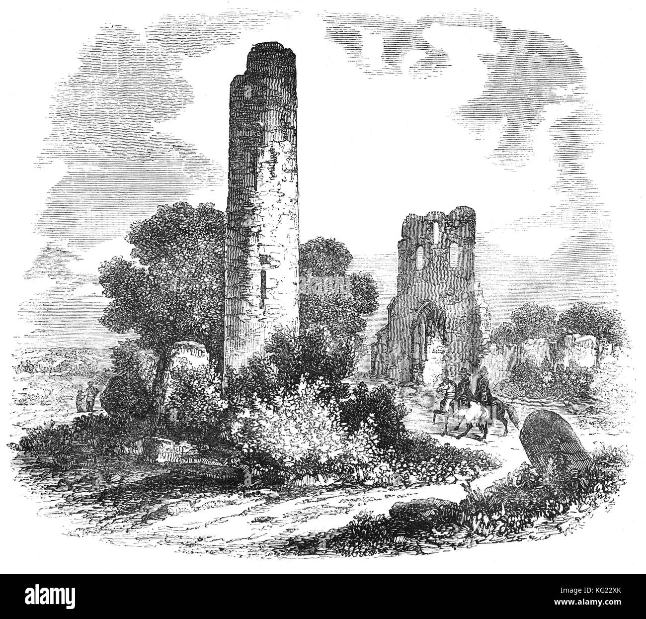 Donaghmore runder Turm wurde in der 9. oder 10. Jahrhundert gebaut. Es ist gut, allerdings fehlt die Konische Kappe erhalten. Ungewöhnliche Funktionen gehören die Steinmetzarbeiten der Köpfe und eine Kreuzigung über und rund um die Tür. Der architektonische Stil der Kirche zeigt an, dass es im 15. Jahrhundert gebaut wurde, wahrscheinlich Ersetzen einer älteren Kirche. In der Nähe von Navan, County Meath, Irland Stockfoto