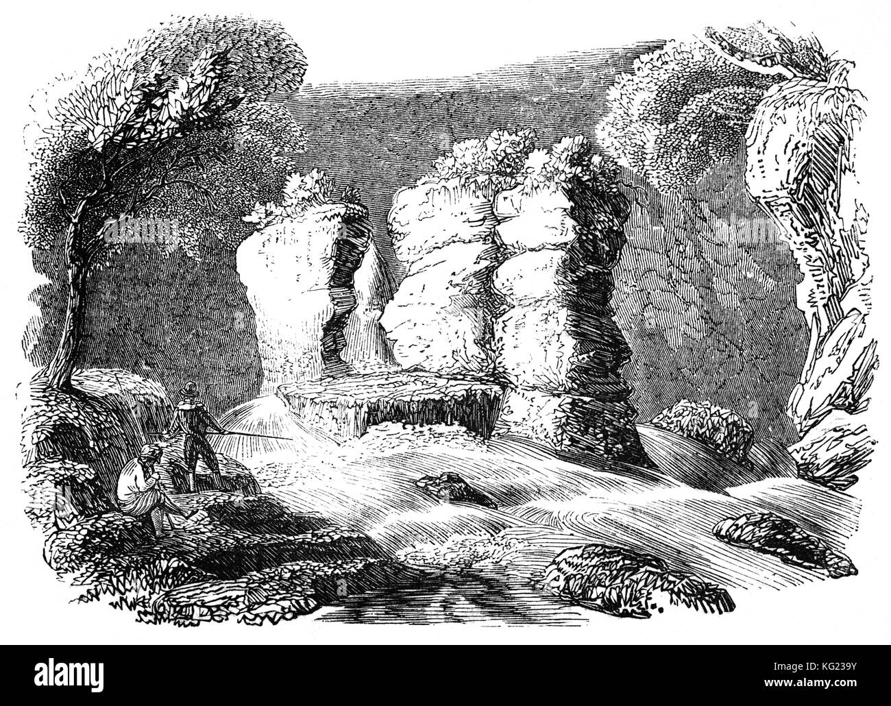 Angler gegenüber Hugh Lloyd's Kanzel, in der Nähe der Ffestiniog. Die Spalte der Rock ist Teil der niedrigeren der zwei Wasserfälle, die auf dem Fluss Cynfal. Dieser schöne Ort ist als Cymorthyn bekannt und Legende schlägt vor, dass Hugh Lloyd von Cynfal Fawr, ein Dichter aus dem 17. Jahrhundert, Astrologen und Magier, verwendet dieser Spot zu besuchen Beschwörungen zu liefern, Gebete für lokale Dorfbewohner führen und Dämonen und böse Geister zu vertreiben. Snowdonia National Park, North Wales Stockfoto