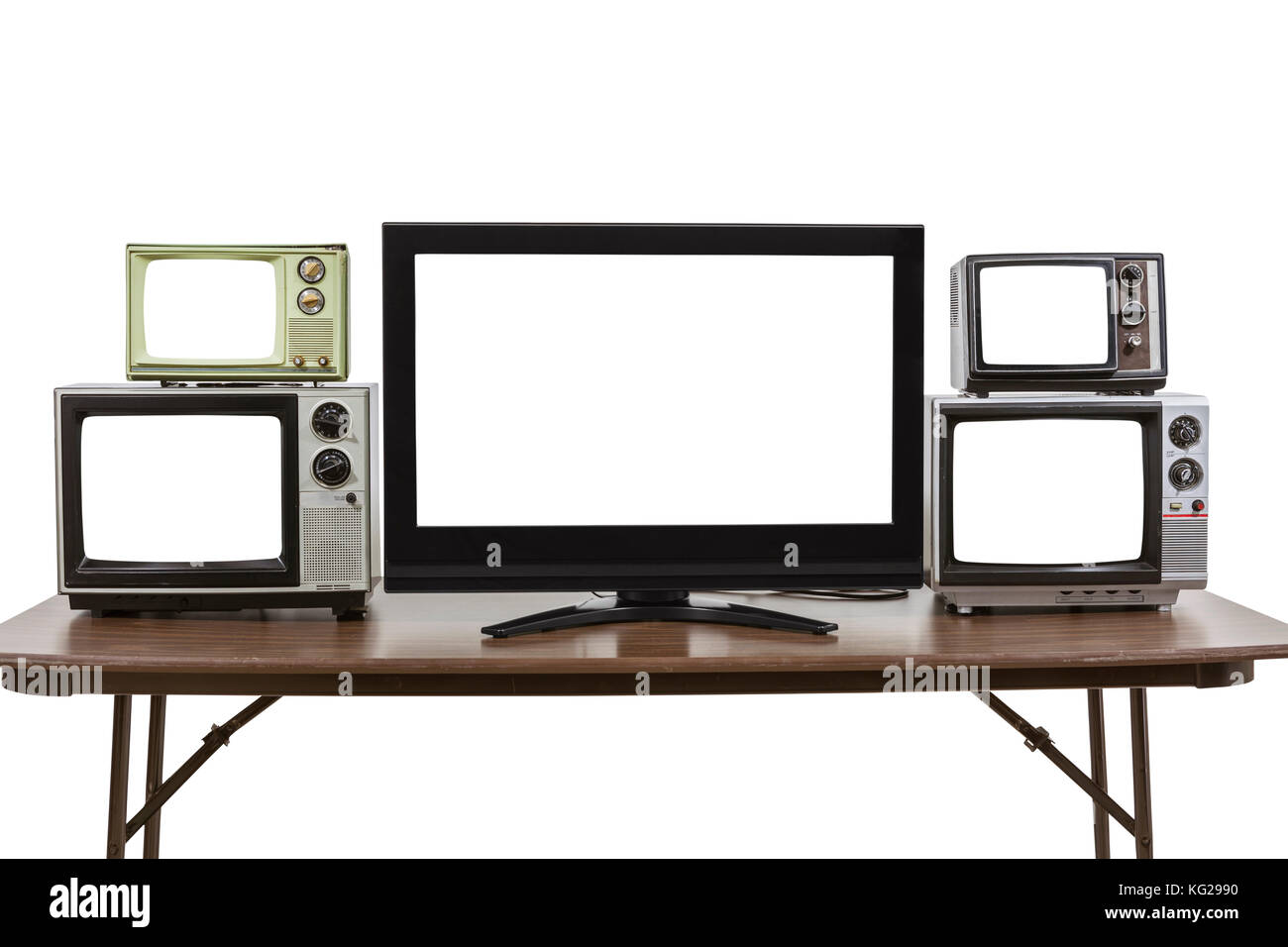 Moderne und klassische Fernseher auf dem Tisch isoliert auf weißem mit ausgeschnittenen Bildern. Stockfoto