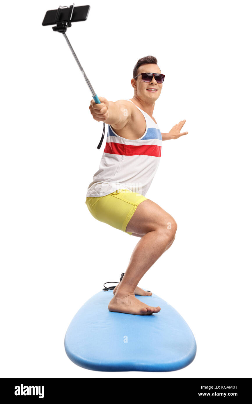 Junger Mann surfen und eine selfie mit einem Stock auf weißem Hintergrund Stockfoto