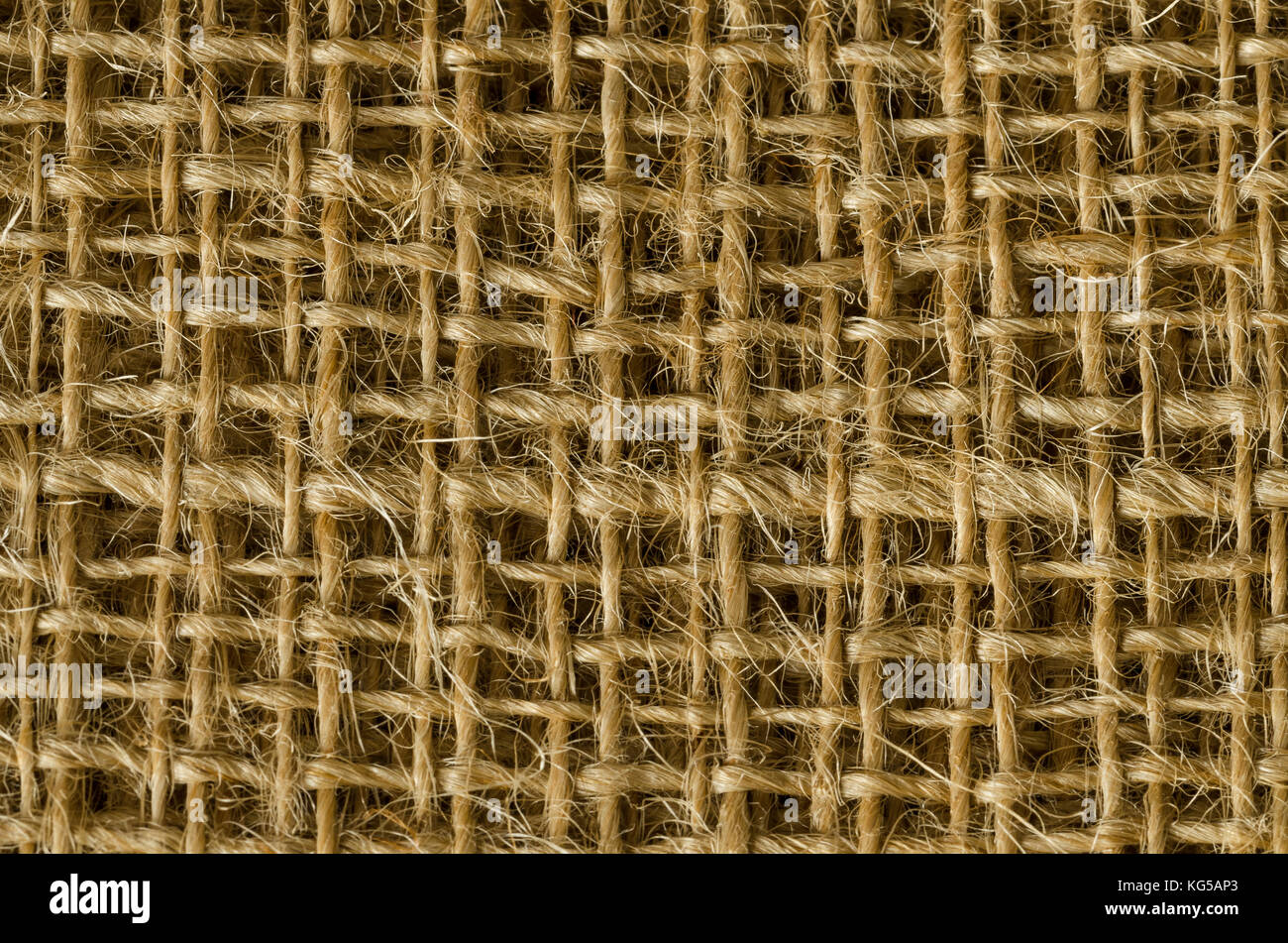 Jutegewebe Schichten von oben. Grobe braun Threads zu grob textile Gewebe, für Taschen verwendet. Auch als raw oder goldene Faser. Foto. Stockfoto