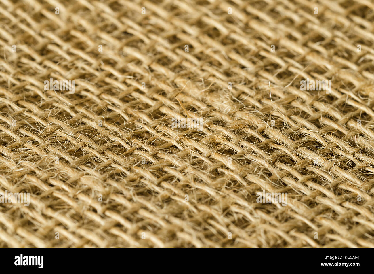 Jutegewebe Schichten Blick diagonal. Grobe braun Threads zu grob textile Gewebe, für Taschen verwendet. Auch als raw oder goldene Faser. Foto. Stockfoto