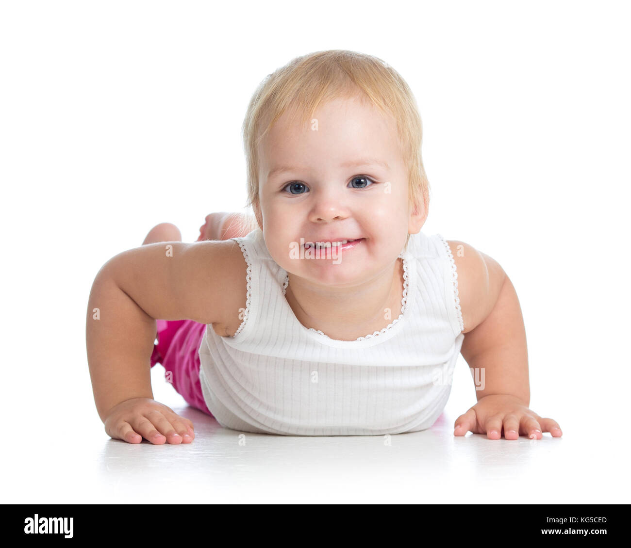 Süße kleine Mädchen liegen auf dem Boden. studio Shot Stockfoto