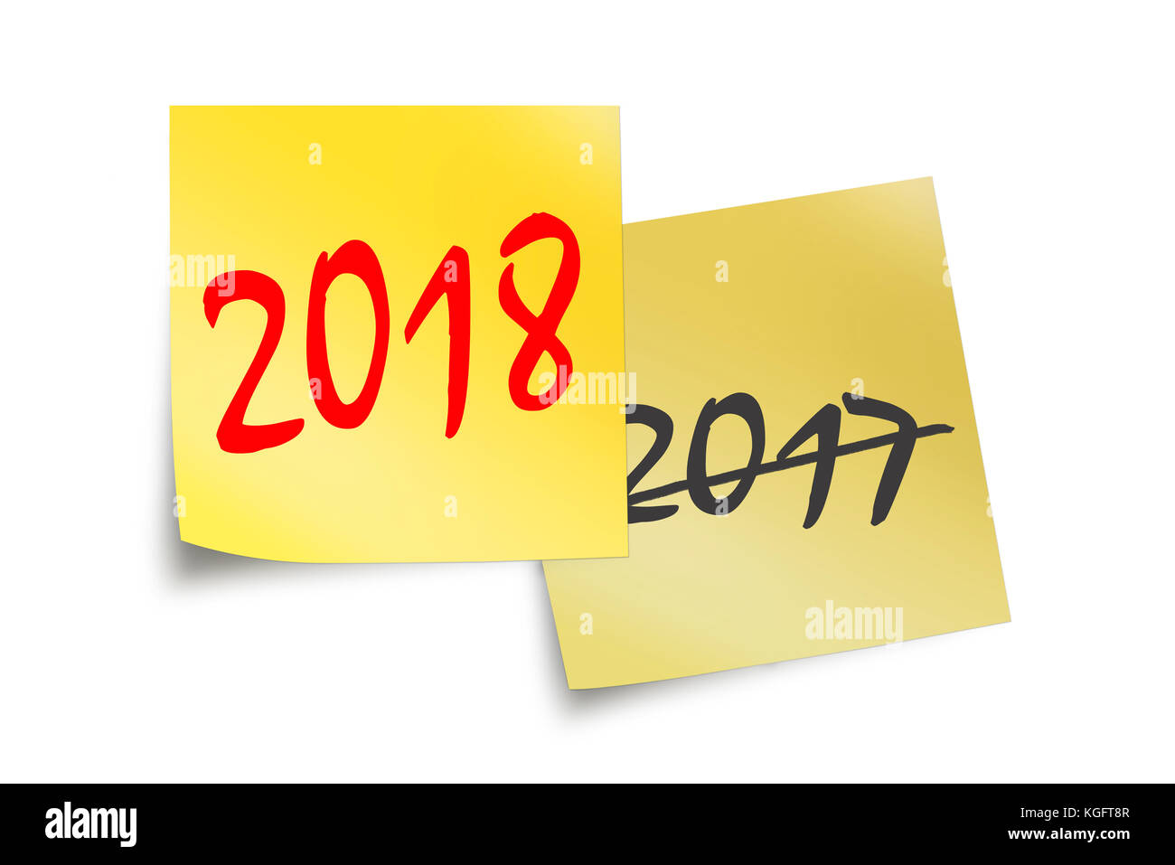2018 und 2017 Geschrieben am gelben Haftnotizen isoliert auf weißem Stockfoto