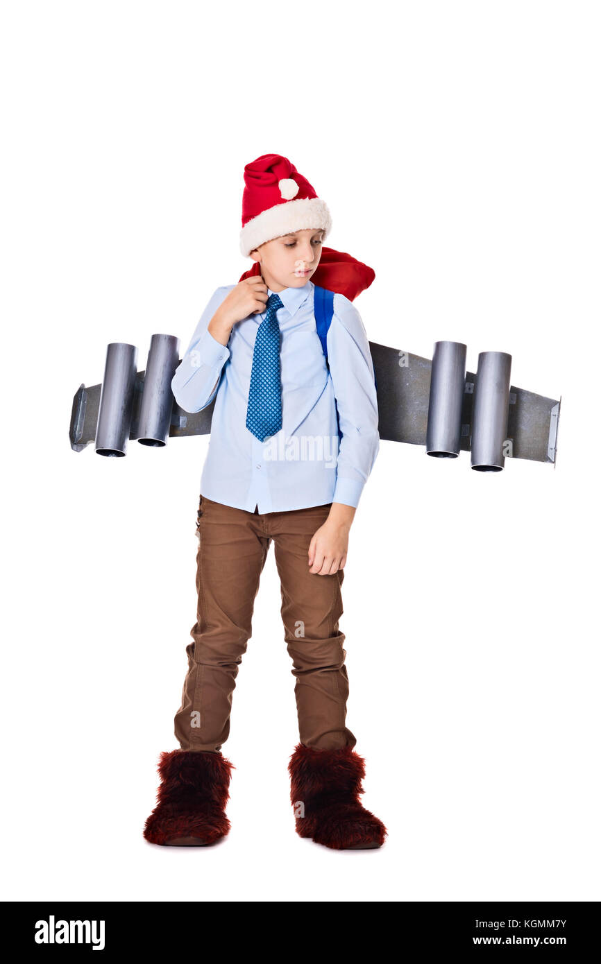 Junge Santa Claus mit einem Jetpack auf dem Rücken hält Geschenke für Weihnachten Stockfoto