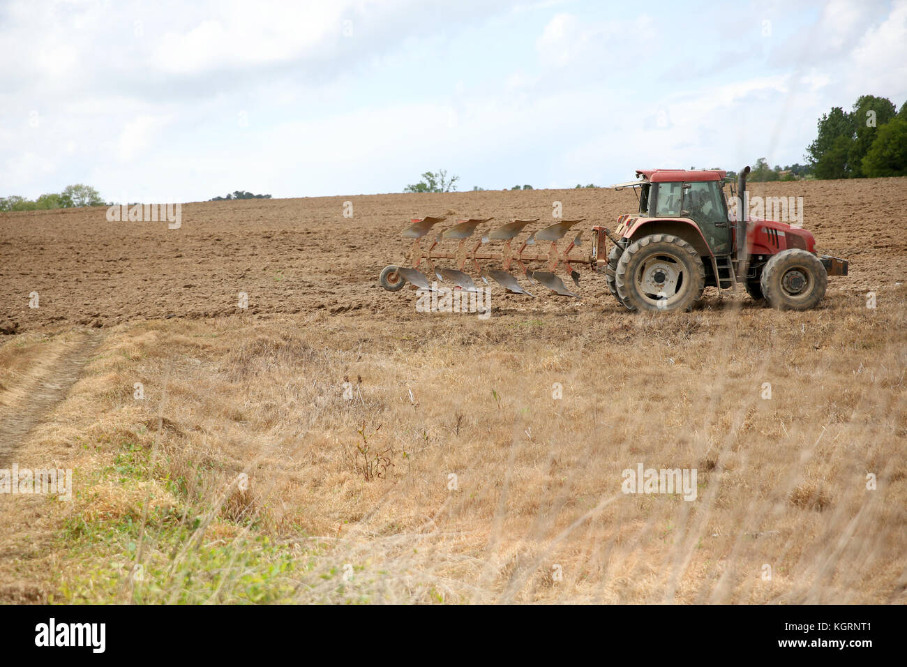 Bei laufendem Traktor in der Agrarwirtschaft Stockfoto