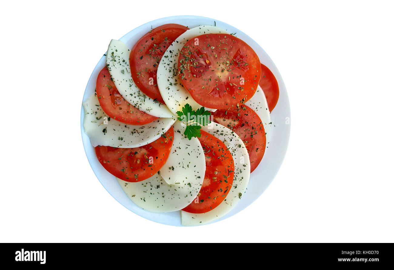 Caprese Salat mit reifen Tomaten und Mozzarella auf weißem Hintergrund Stockfoto