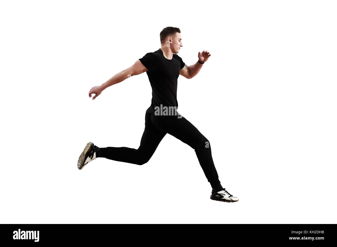 Athletischer Mann laufen auf weißem Hintergrund. Stockfoto