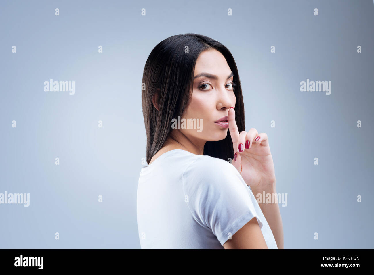 Schöne junge Lehrer anspruchsvolle Schweigen während der Prüfung Stockfoto