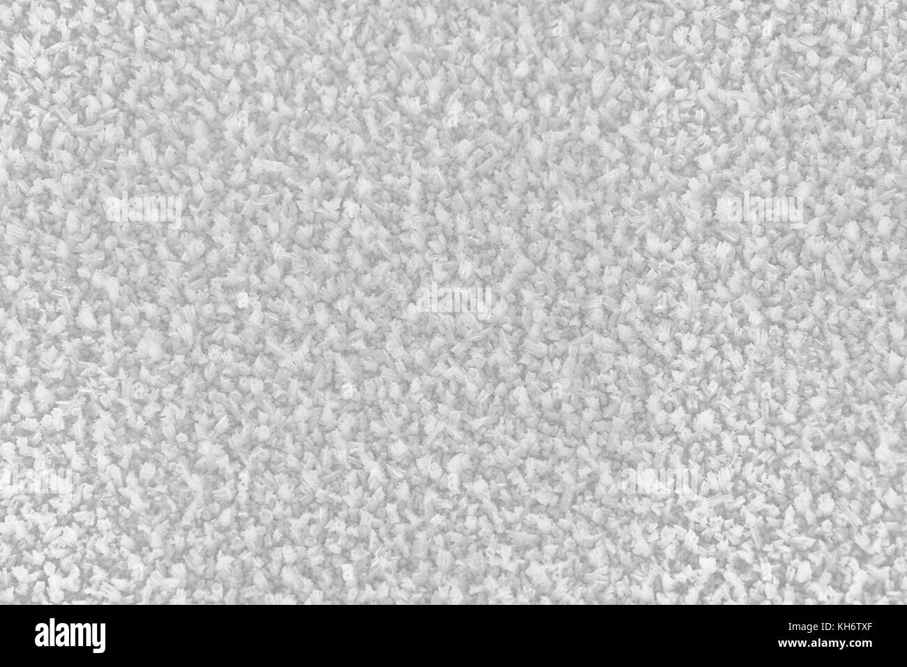 Der Bereich der Schnee Eiskristalle an einem sonnigen kalten Wintertag. Textur. Stockfoto