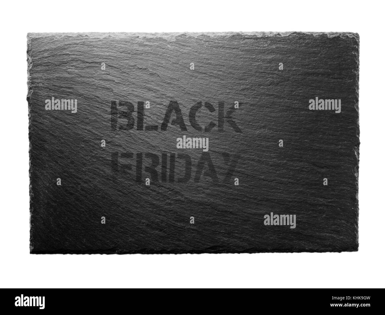Schwarzer Freitag Schablone auf den dunkelgrauen Schiefer Platte isoliert auf Weiss. Schnäppchen Verkauf Konzept. Stockfoto