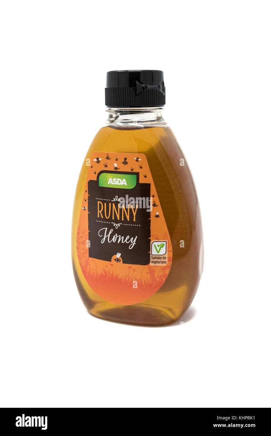 Jar von Asda flüssiger Honig auf weißem Hintergrund Stockfoto