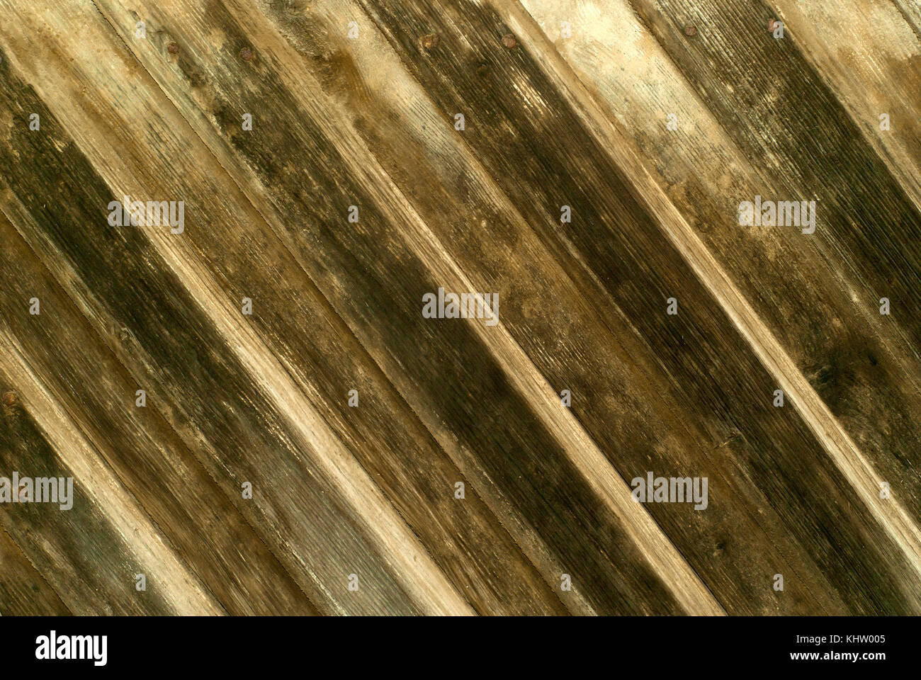 Hintergrund, Textur: an der Wand der diagonal überlappenden Planken aus der Zeit abgedunkelt Stockfoto