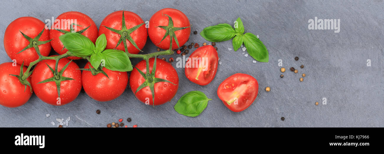 Tomaten Tomaten rote Gemüse banner Schiefer Draufsicht Basilikum Stockfoto