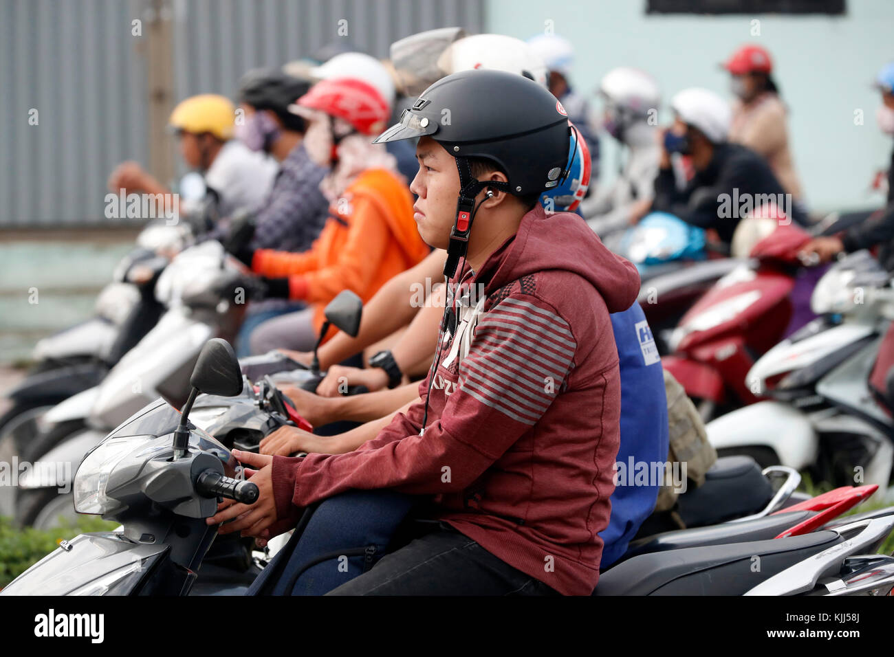 Vietnamesische Volk auf Motorrädern. Straßenverkehr. Ho Chi Minh City. Vietnam. Stockfoto