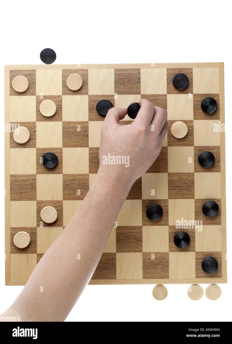 Hand bewegen der Checker Stück Stockfoto