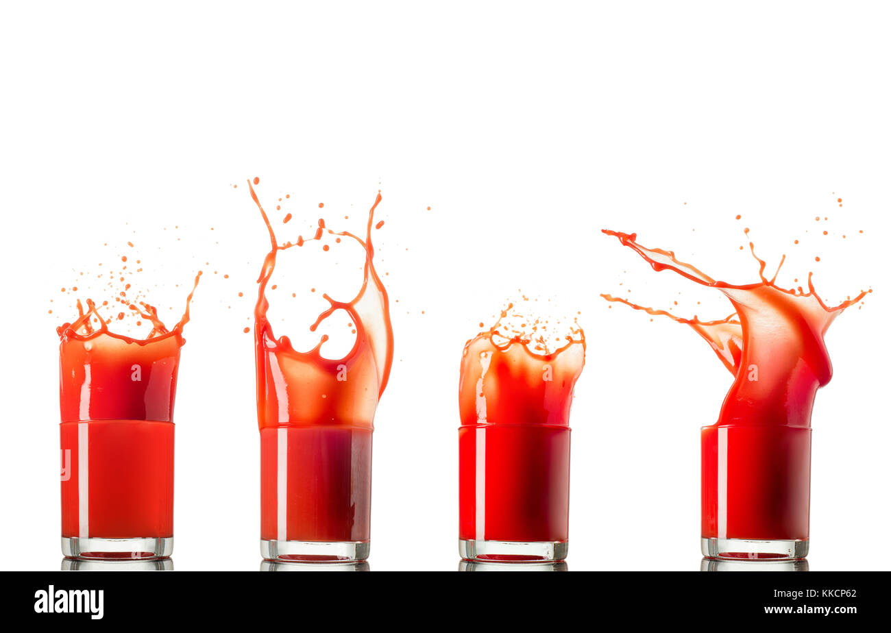 Satz von 4 Tomatensaft im Glas splash um großartige Wellen gemacht und dropsisolated auf weißem Hintergrund. Stockfoto