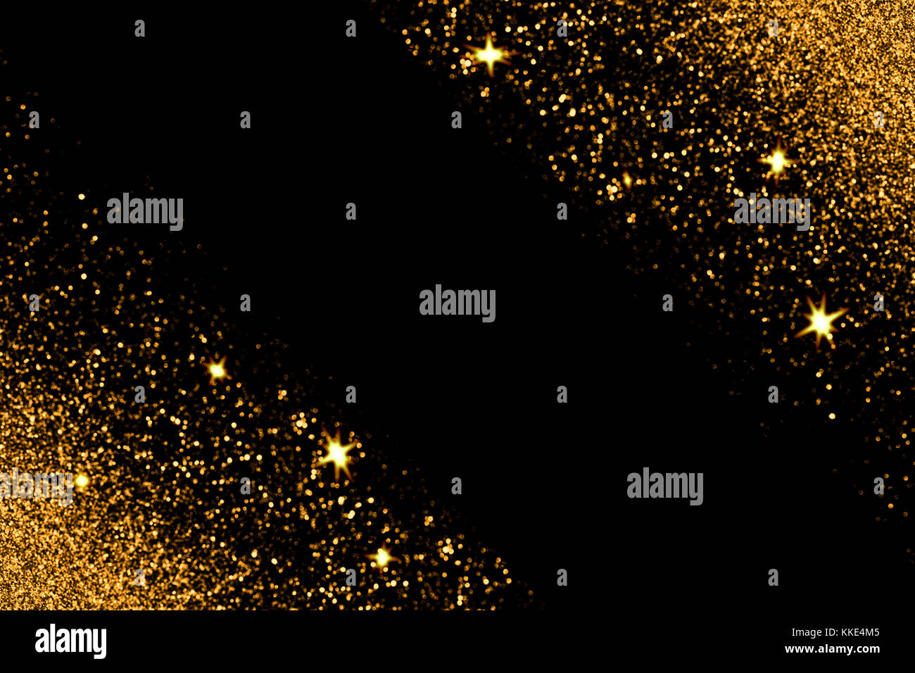 Gold Glitzer mit glühenden Funken Licht auf einem schwarzen Hintergrund. Urlaub Grußkarte. Stockfoto