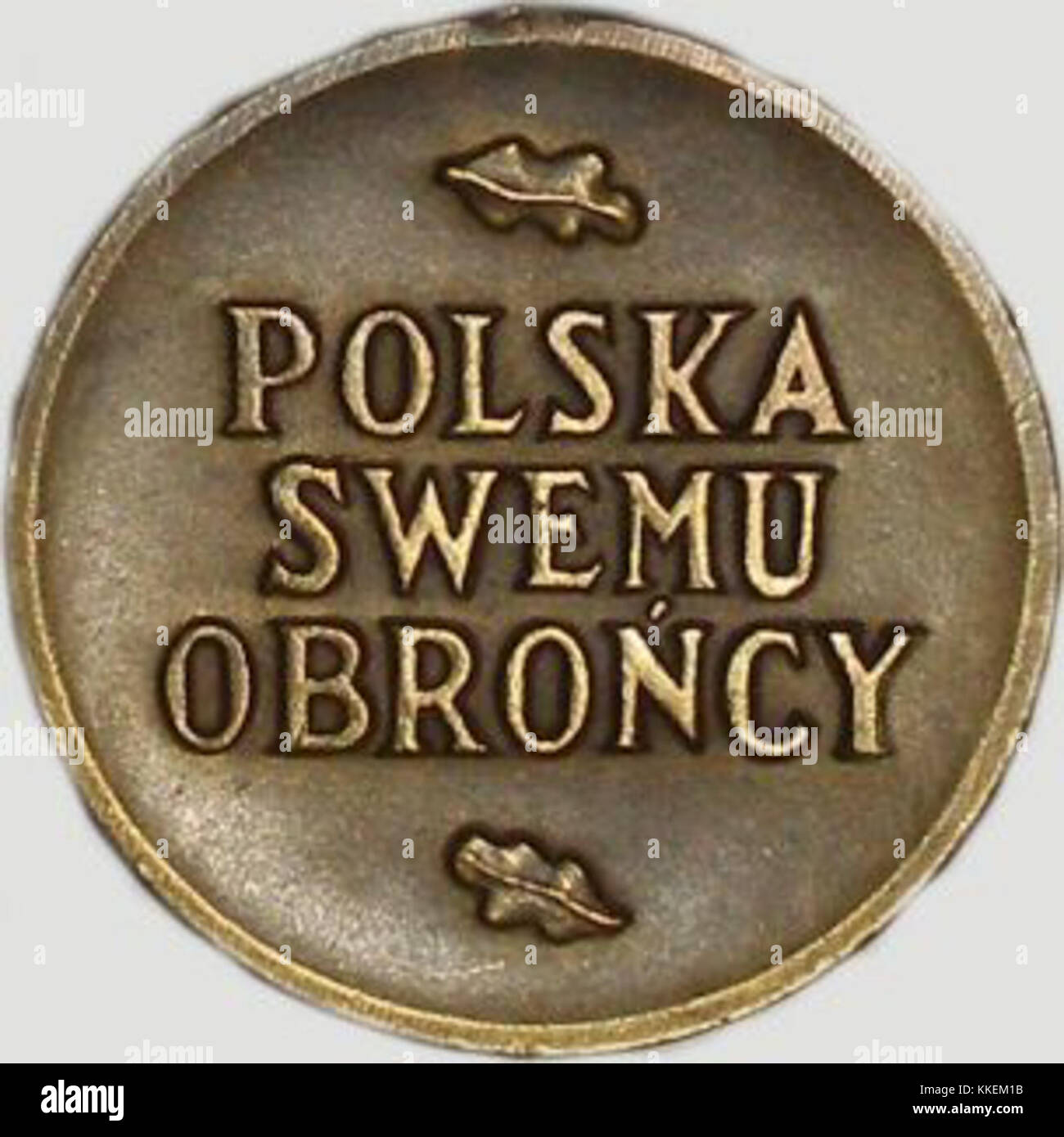 Dieses Bild zeigt eine Medaille, wahrscheinlich vom Militär, mit der Inschrift „Wojska“ (auf Polnisch „Armee“). Sie stellt eine militärische Auszeichnung oder Anerkennung dar, möglicherweise von der polnischen Armee oder in Bezug auf Militärdienst und Tapferkeit. Stockfoto