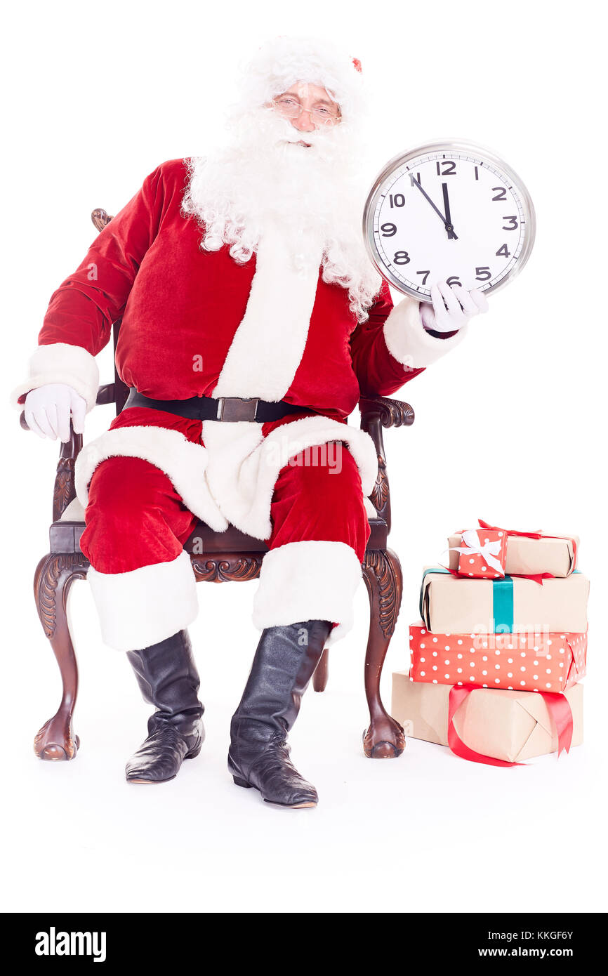Der Weihnachtsmann hält die Uhr Stockfoto