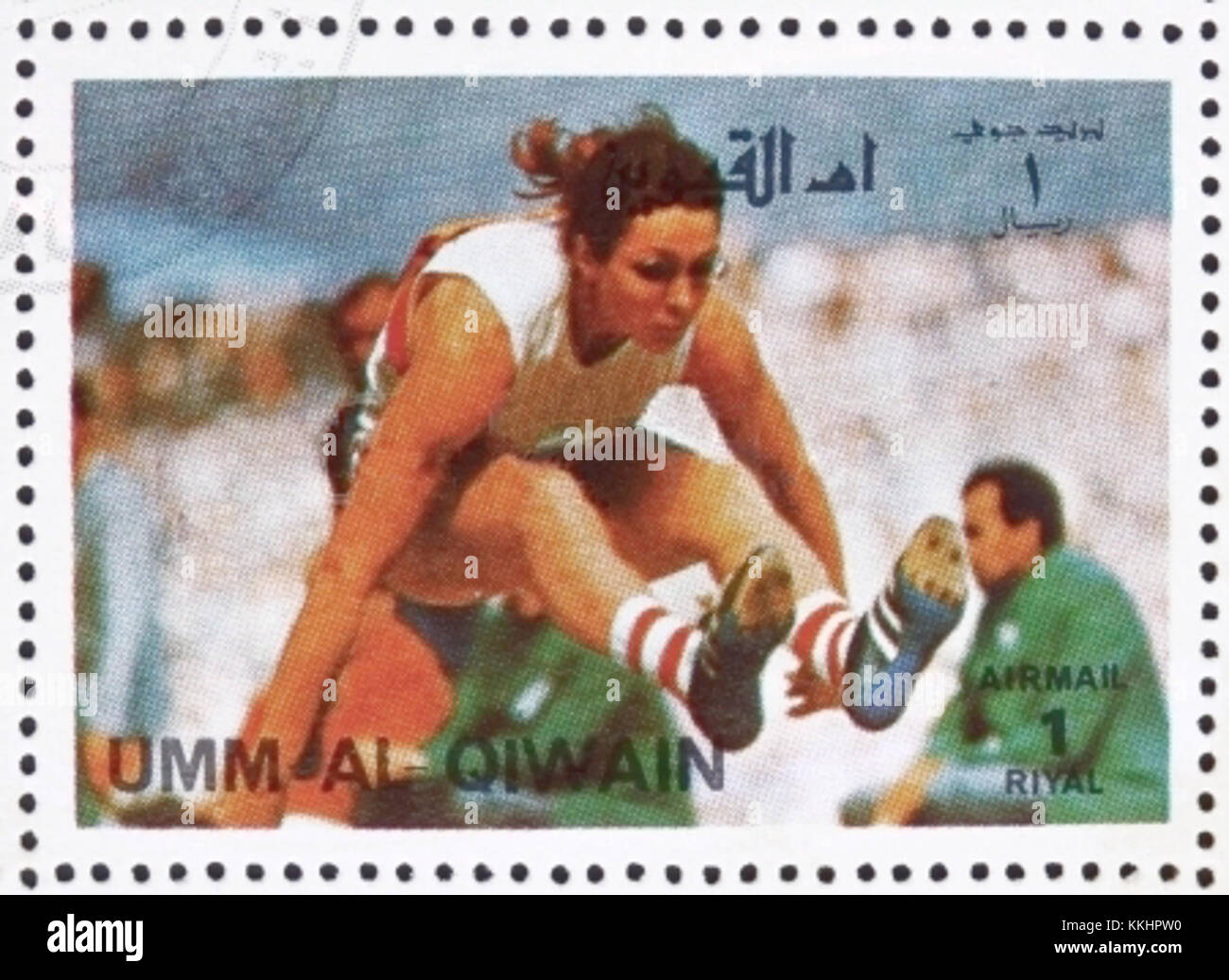 Die Umm al-Quwain Marke 1972 mit Heide Rosendahl unterstreicht den Erfolg der deutschen Athletin bei den Olympischen Sommerspielen 1972, wo sie im Weitsprung eine Goldmedaille gewann. Stockfoto