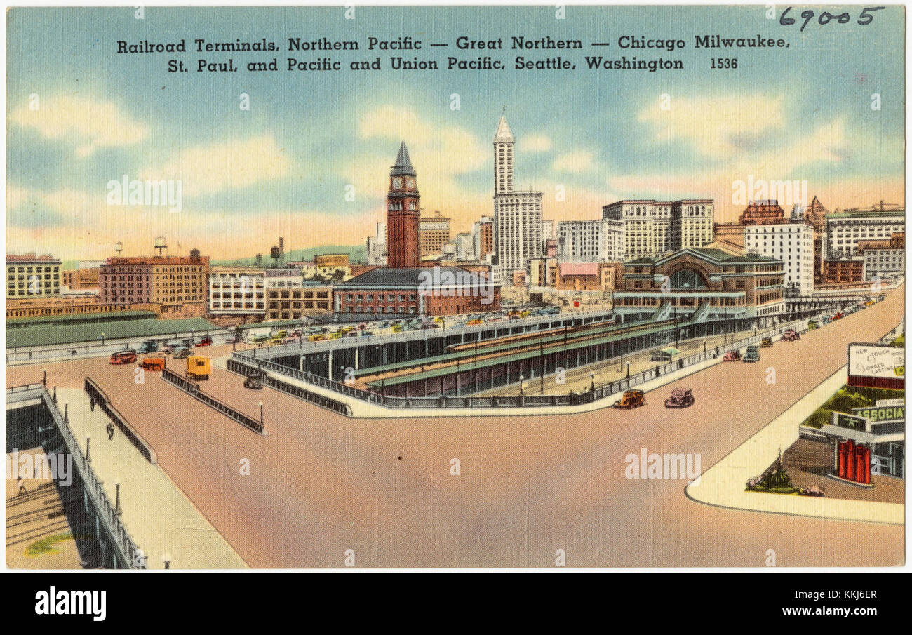 Ein historisches Bild verschiedener Eisenbahnterminals in Seattle, Washington, einschließlich Northern Pacific, Great Northern, Chicago Milwaukee, St. Paul, Pacific und Union Pacific, die die Bedeutung des Schienenverkehrs in der Region verdeutlichen. Stockfoto
