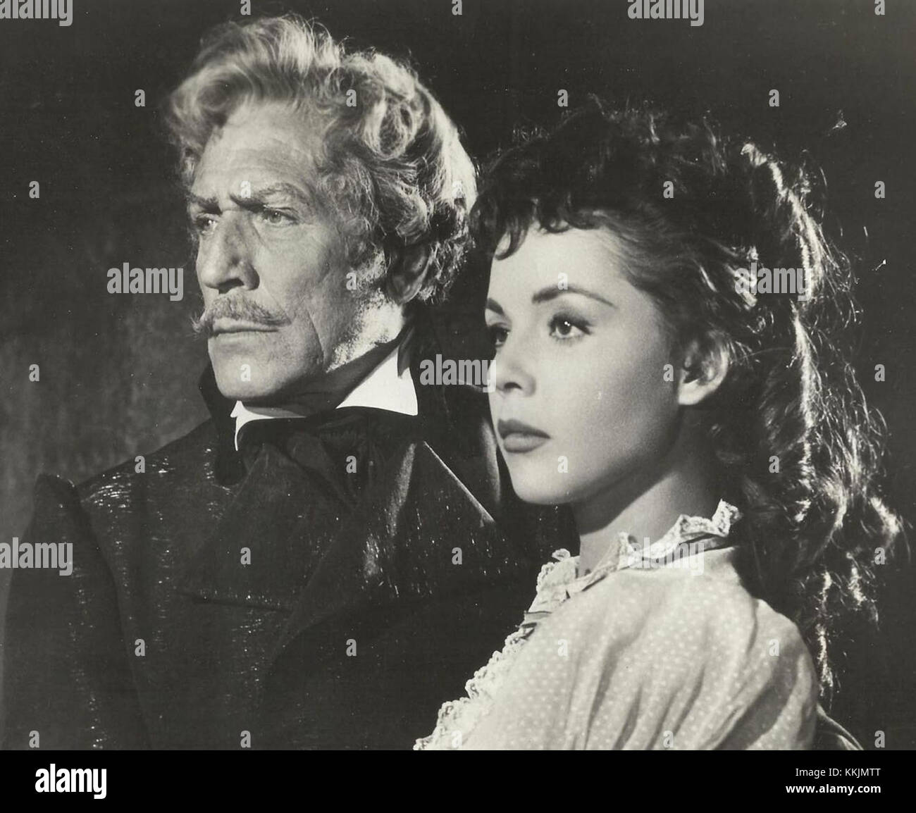 Paul Cavanagh und Colleen Miller spielten die Hauptrollen in dem Film The Purple Mask, einem Hollywood-Film aus den 1940er Jahren. Ihre Rollen im Film waren ein wichtiger Teil ihrer Schauspielkarriere während der klassischen Filmzeit. Stockfoto