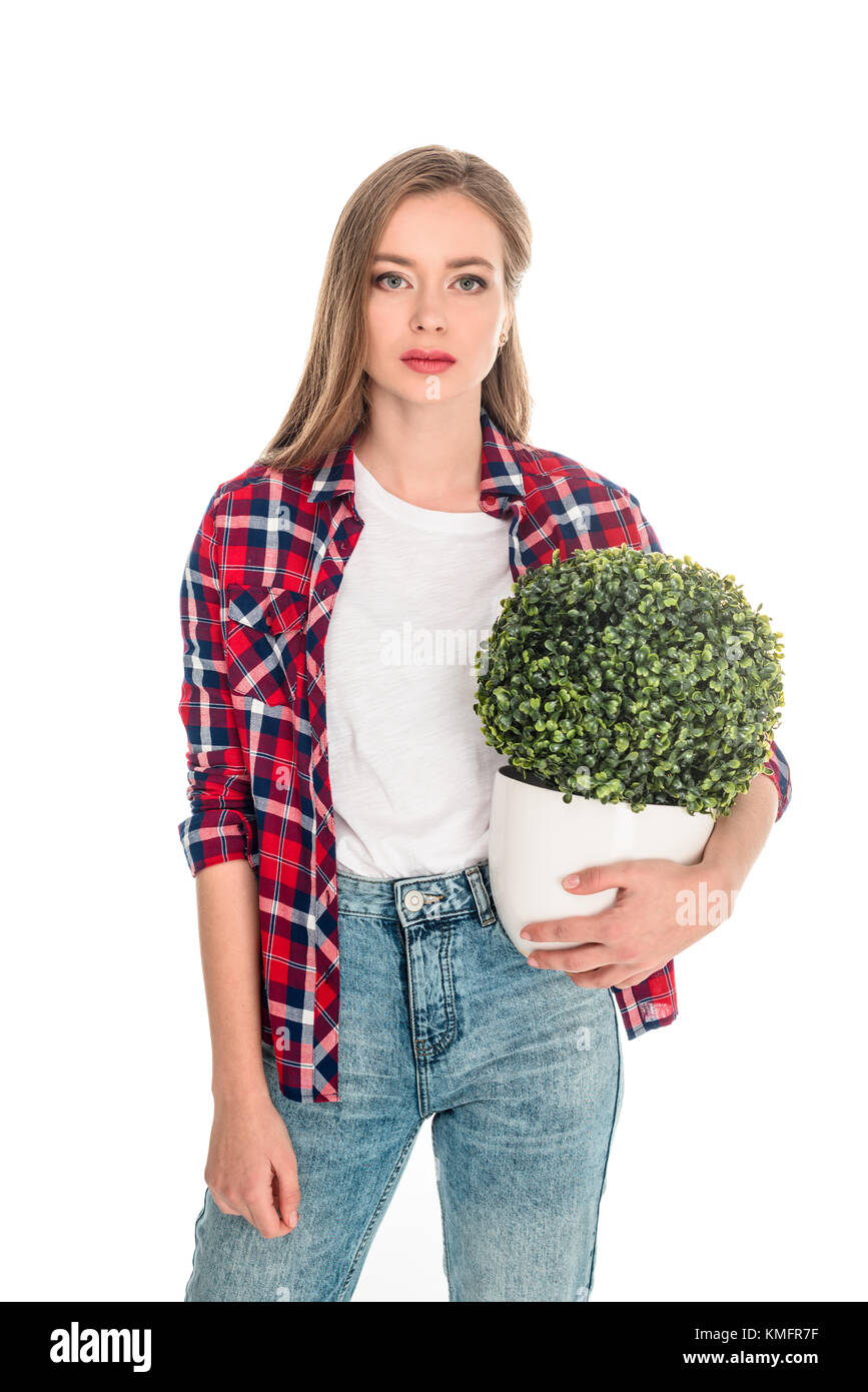 Mädchen mit grüne Pflanze im Topf Stockfoto
