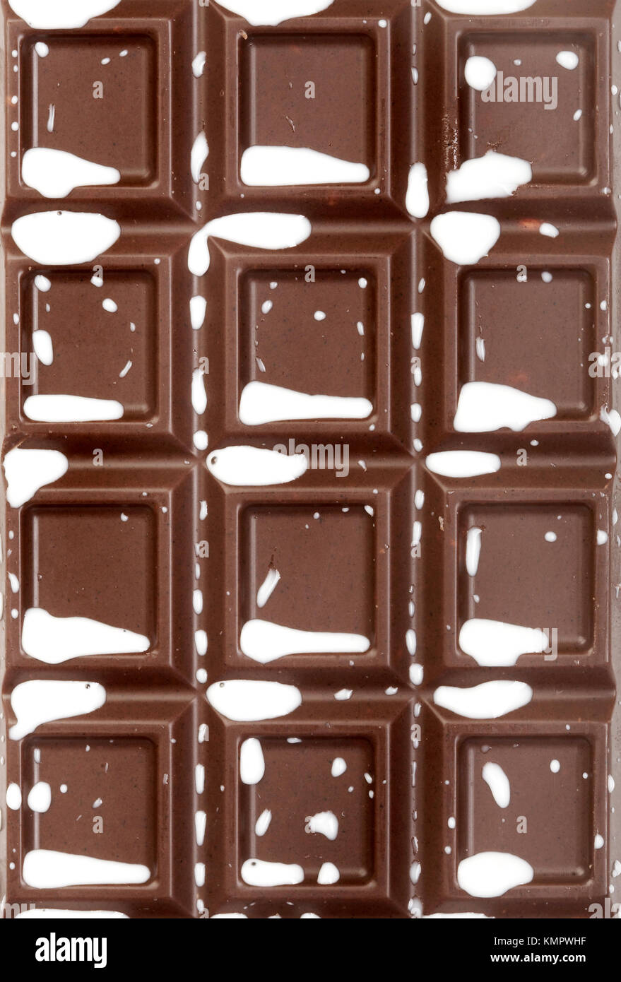 Schokolade-Kachel mit Milch spritzt Stockfoto