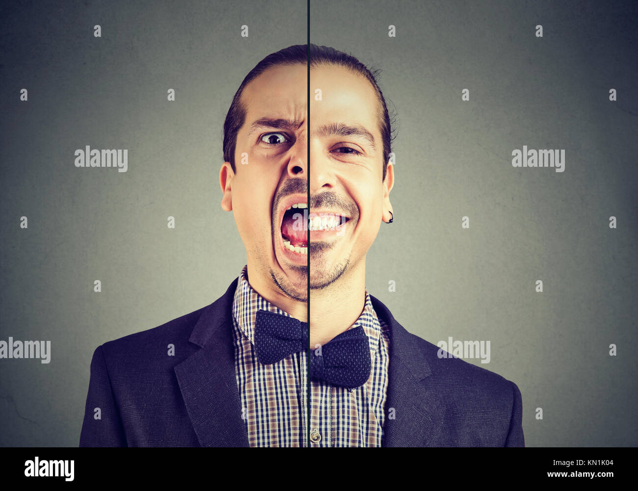 Bipolare Störung Konzept. Junge Geschäftsmann mit einem Gesichtsausdruck auf grauem Hintergrund Stockfoto