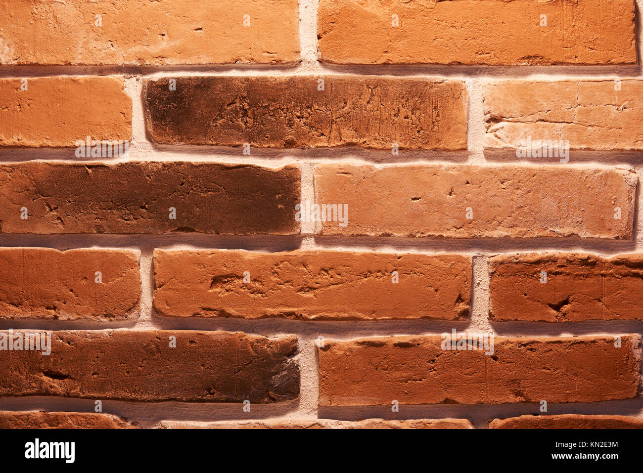 Makro von Mauer. Grunge Beton aus rotem Backstein Hintergrund Stockfoto