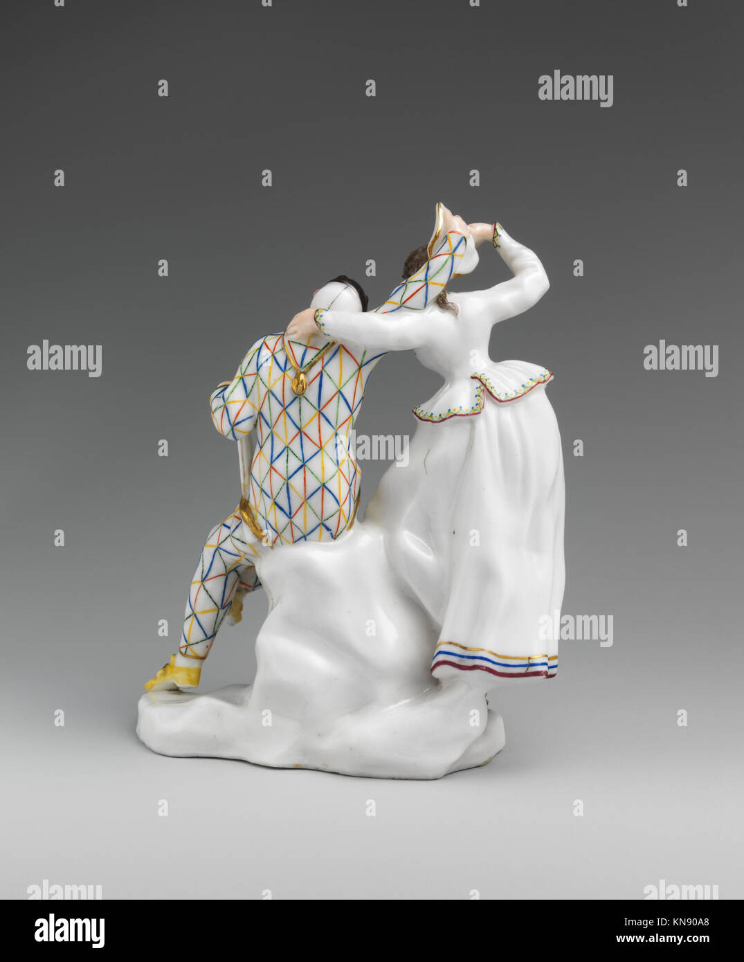 Dieses Kunstwerk zeigt Harlequin und Columbine, Charaktere aus Commedia dell'Arte, einer italienischen Theatertradition, die für ihre maskierten Darsteller, stilisierten Kostüme und Improvisationsschauspiele bekannt ist. Stockfoto