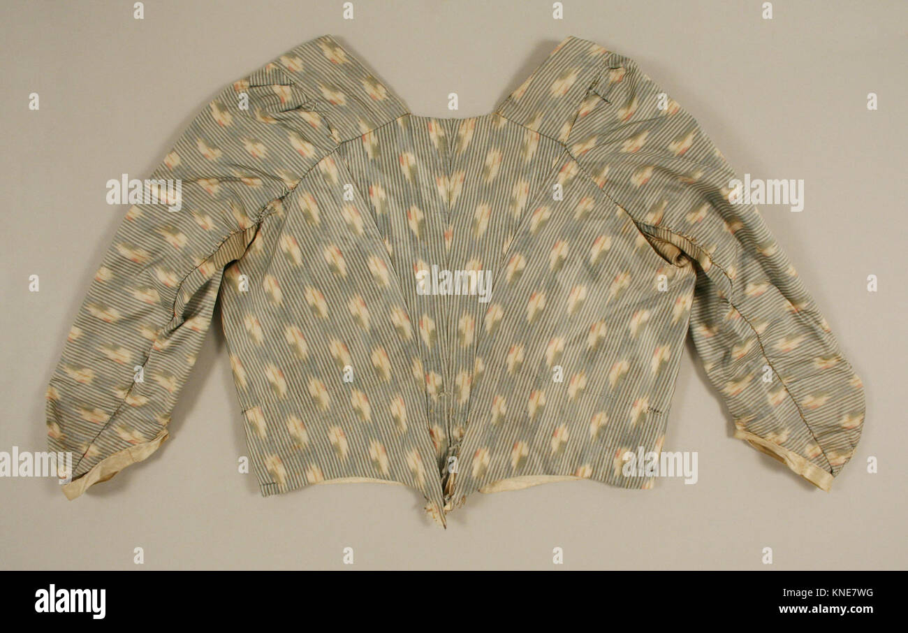 Diese Illustration zeigt ein historisches Kleid, das für redaktionelle Zwecke fotografiert wurde und einen Vintage-Stil aus einer vergangenen Zeit darstellt. Stockfoto