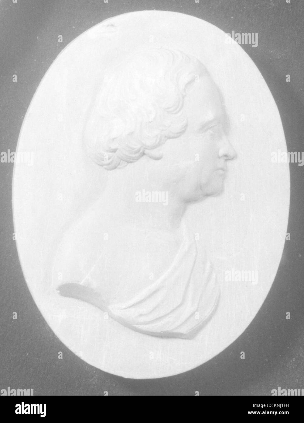 Cameo-Porträt eines Gentlemen, in Stein gemeißelt, repräsentiert sozialen Status und künstlerische Handwerkskunst, typisch für alte griechische und römische Traditionen. Stockfoto