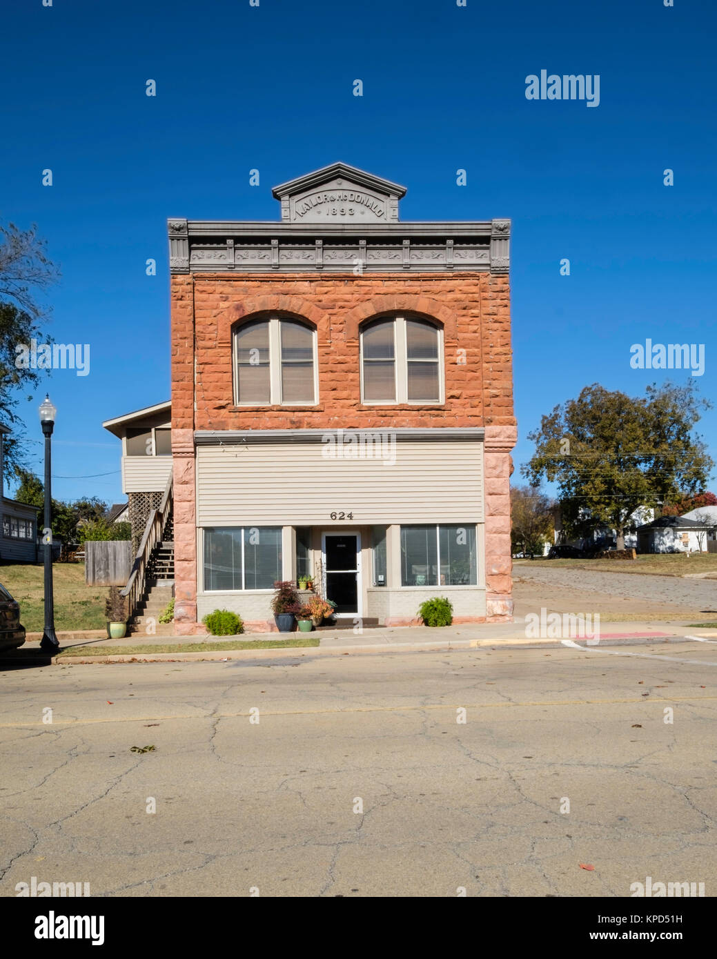 Kaylor & McDonald Gebäude, ca. 1893, gebaut von Red native Sandstein, 624 E Oklahoma Ave., Guthrie, Oklahoma, USA. Guthrie Historic District. Stockfoto