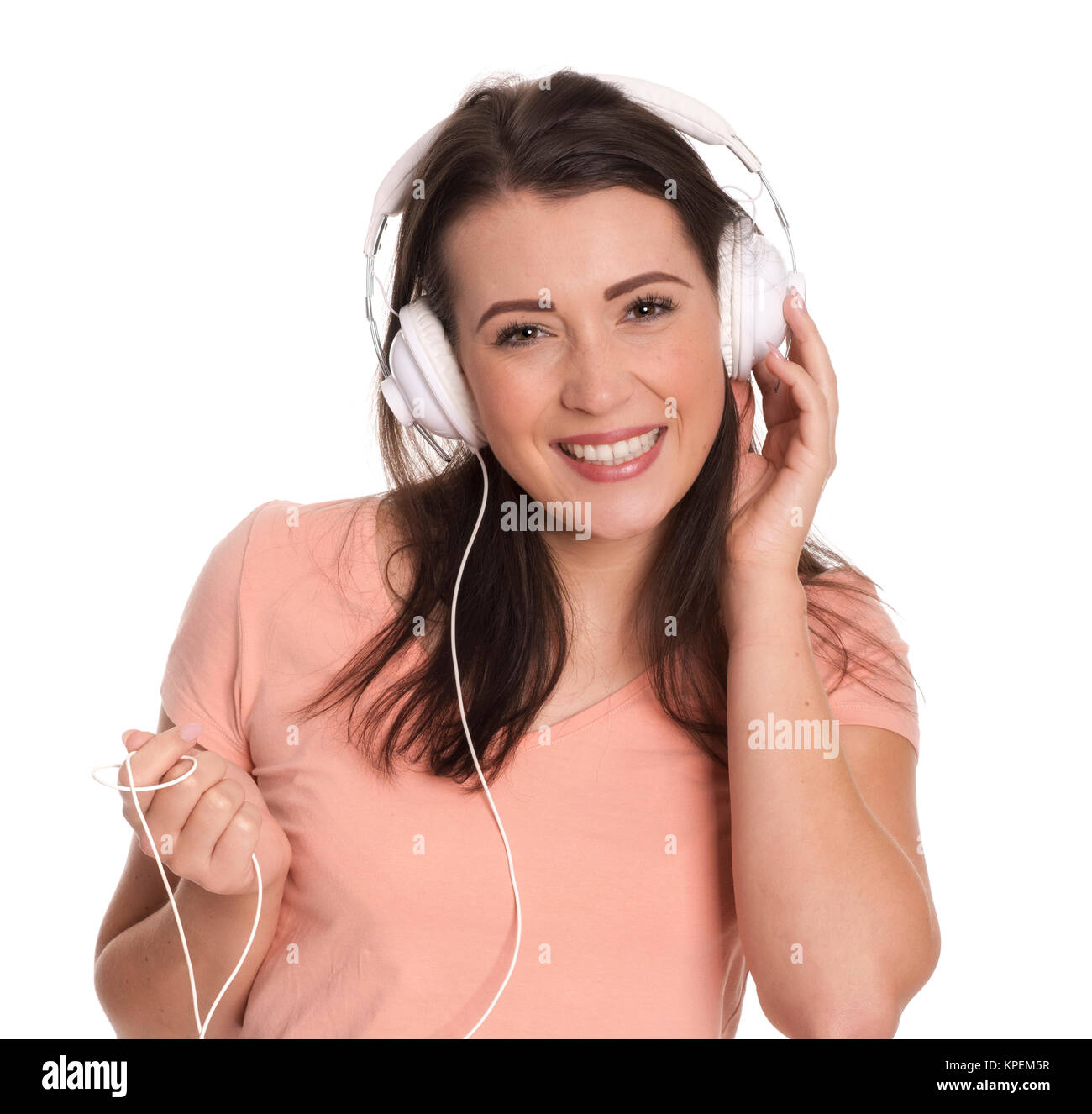 Junge Frau mit Kopfhörer lächelnd Stockfoto