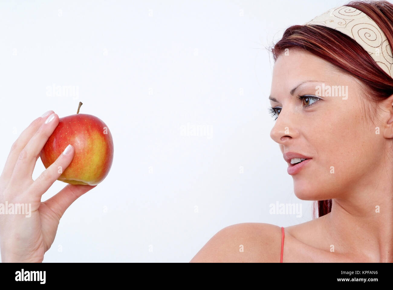 Junge Frau Mit Apfel in der Hand - Frau mit Apfel Stockfoto