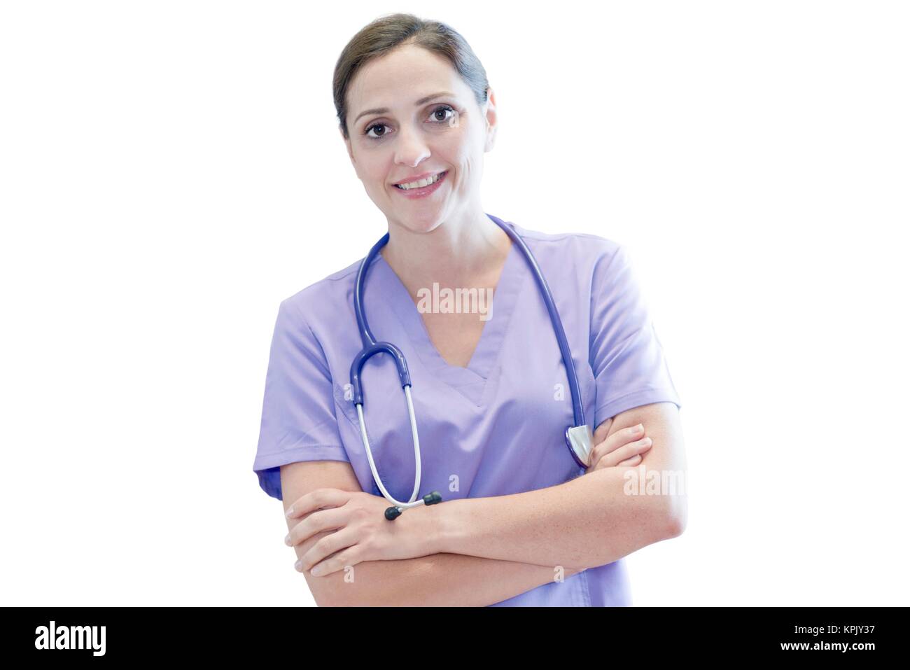 Krankenschwester trägt Lila einheitliche lächelnd in Richtung Kamera, Portrait. Stockfoto