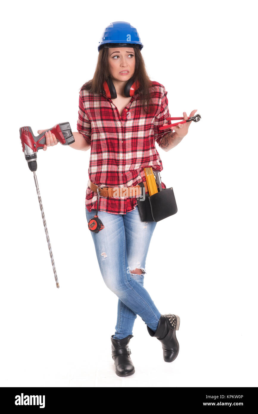 Weibliche Handwerker mit Bohrer sieht skeptisch Stockfoto
