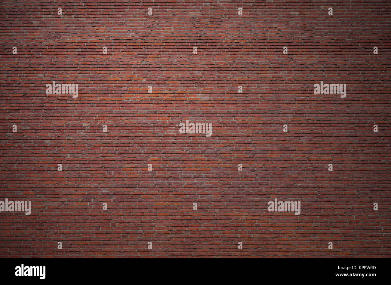 Alte Backsteinwand aus roten Steinen als Grunge Hintergrund Stockfoto