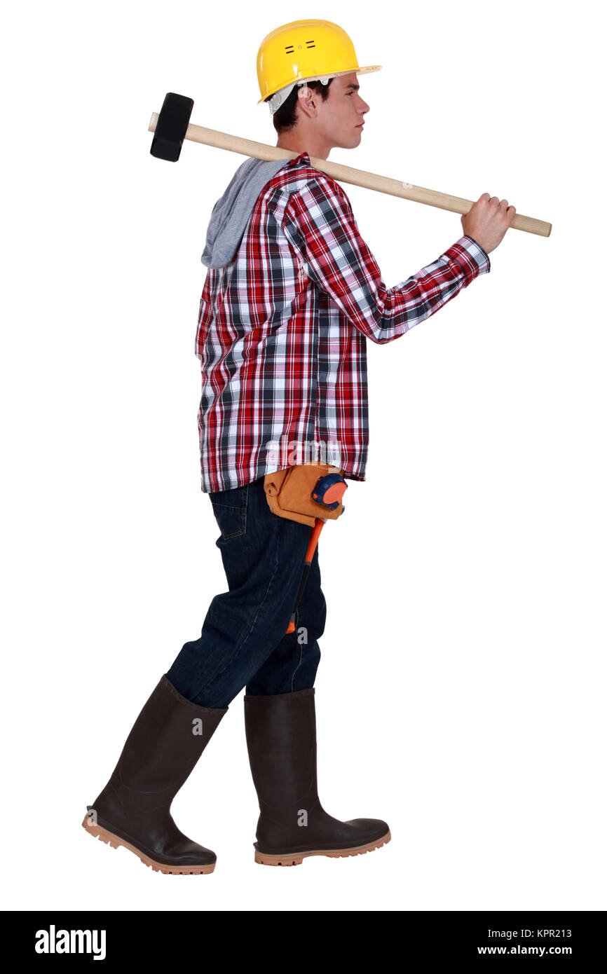 Junger Arbeiter mit einem Vorschlaghammer Stockfoto