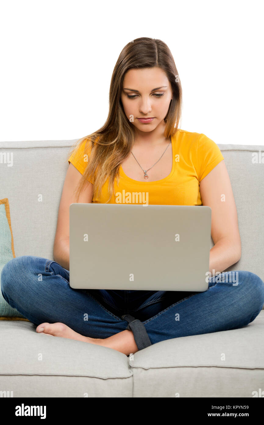Schöne Frau zu Hause arbeiten mit ihrem laptop Stockfoto